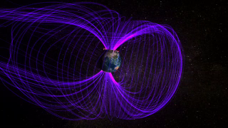 A magnetosphere is the region surrounding a planet where the planet's magnetic field dominates. Because the ions in the solar plasma are charged, they interact with these magnetic fields, and solar wind particles are swept around planetary magnetospheres. 

The shape of the Earth's magnetosphere is the direct result of being blasted by solar wind. Solar wind compresses its sunward side to a distance of only 6 to 10 times the radius of the Earth. A supersonic shock wave called the bow shock is created sunward of Earth. Most of the solar wind particles are heated and slowed at the bow shock and detour around the Earth. Solar wind drags out the night-side magnetosphere, called the magnetotail. Many other planets in our solar system have magnetospheres of similar, solar wind-influenced shapes.