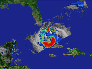 Precipitation rates on the ground superimposed on an cloud image of Hurricane Georges taken on September 27, 1998.  Red represents regions of highest rainfall.