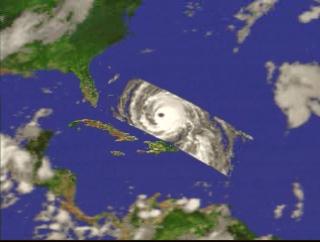 A fly-in to Hurricane Floyd on September 13, 1999, showing the three-dimensional structure of the precipitation as measured by the Precipitation Radar instrument on TRMM.  In this animation, a surface of constant precipitation is colored by the value of the precipitation on the ground under the surface.  The global cloud cover data was measured by GOES.