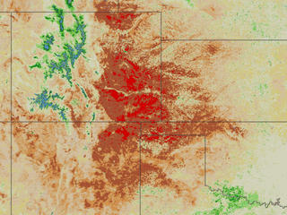 Images created from France's SPOT satellite show the health of vegetation as severely weakened indicating very dry conditions over large areas of the western U.S.