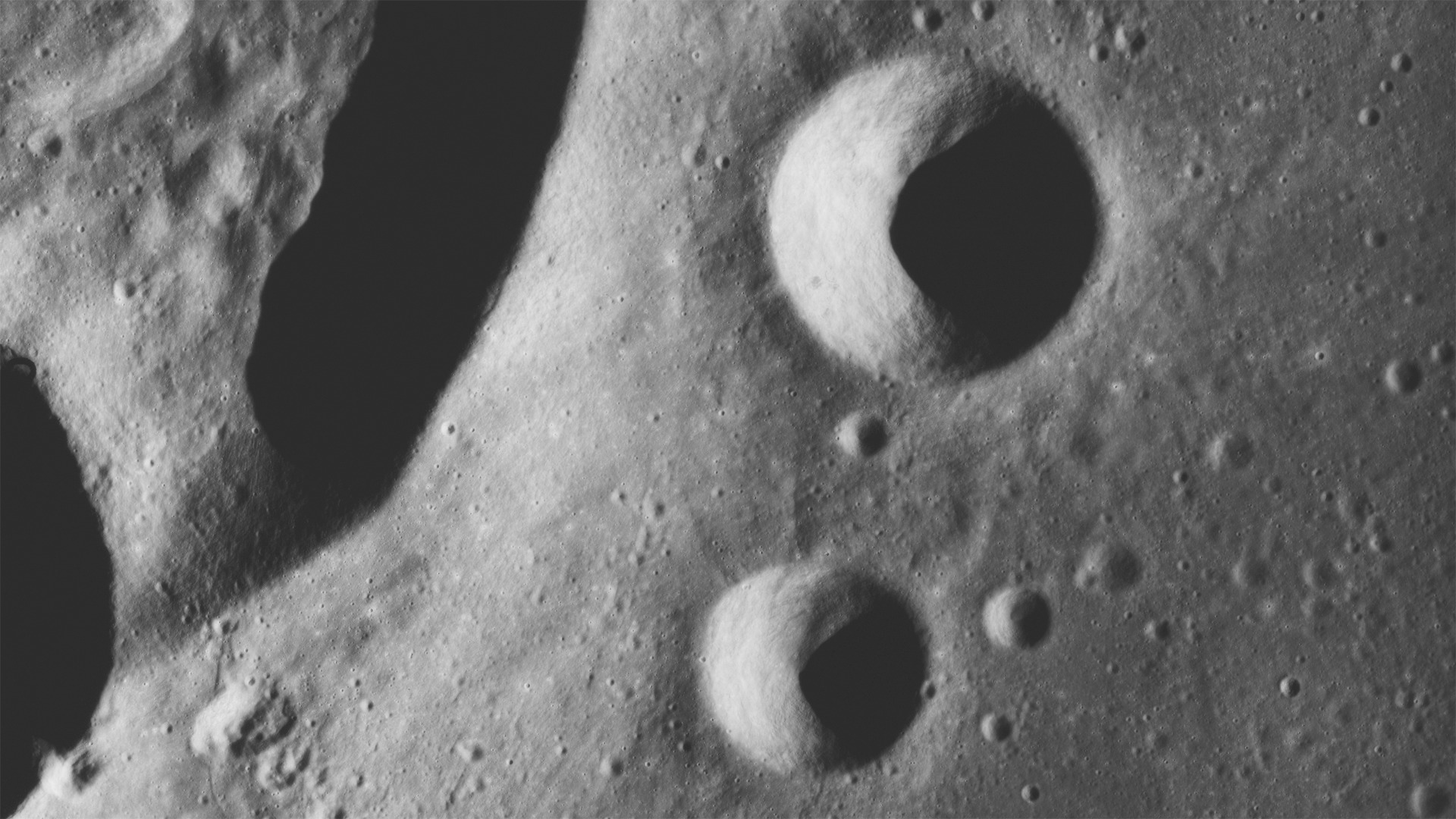Stereo imagery featuring craters: Krieger, Rocco, Ruth and the edge of Van Biesbroeck. Stereoscopic imagery is provided for the left and right eye.