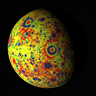 The GRAIL free-air gravity map of the Moon, rendered on the Moon's surface as it floats in front of a starry backdrop (the constellation Hydra). About 75% of the visible disk is illuminated from the left, lighting longitudes roughly between 75&deg; and 180&deg; east. The view is centered on Mare Moscoviense, a feature on the far side.