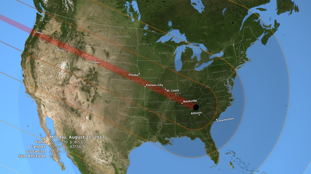 A view of the United States during the total solar eclipse of August 21, 2017, showing the umbra (black oval), penumbra (concentric shaded ovals), and path of totality (red) through or very near several major cities.