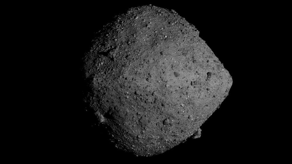 Print resolution (5760x3240 pixels) still image of Bennu. The Nightingale sample site is visible in the northern hemisphere.