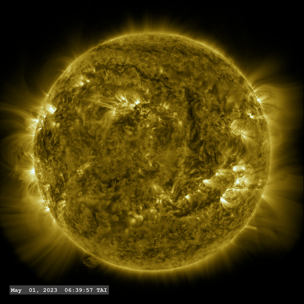 A view of a very active coronal plasma loop (lower solar limb) in this long view using the SDO AIA 171A filter.