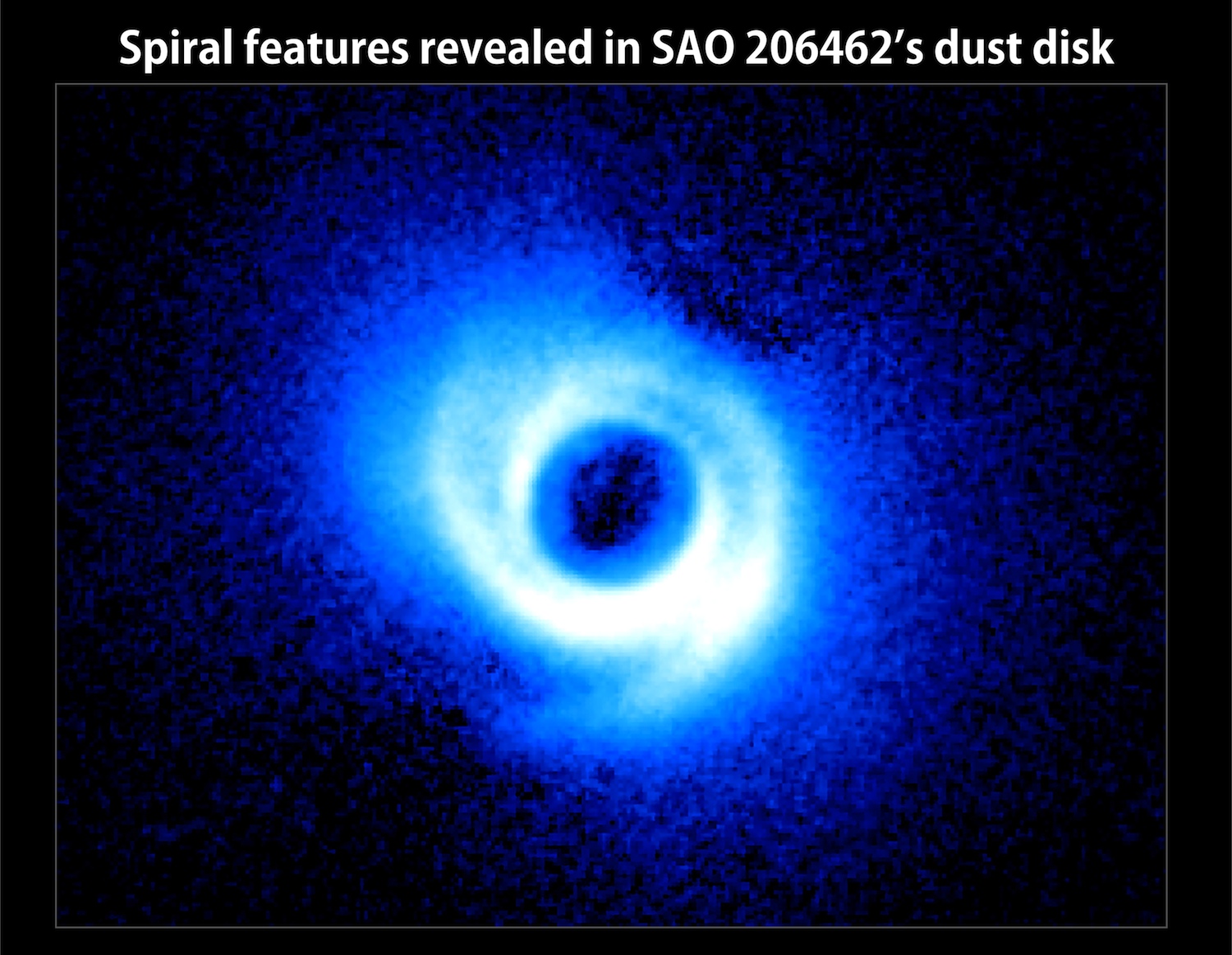 Two spiral arms emerge from the gas-rich disk around SAO 206462, a young star in the constellation Lupus. This image, acquired by the Subaru Telescope and its HiCIAO instrument, is the first to show spiral arms in a circumstellar disk. The disk itself is some 14 billion miles across, or about twice the size of Pluto's orbit in our own solar system. No Labels. Credit: NAOJ/Subaru