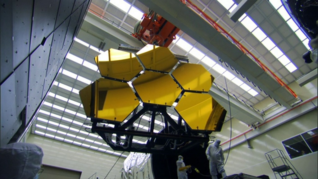 The Webb Telescope's primary mirror has 18 hexagonal mirror segments. This footage taken at the NASA Marshall Space Flight Center shows 6 primary mirror segments being prepared readied for cryogenic testing.