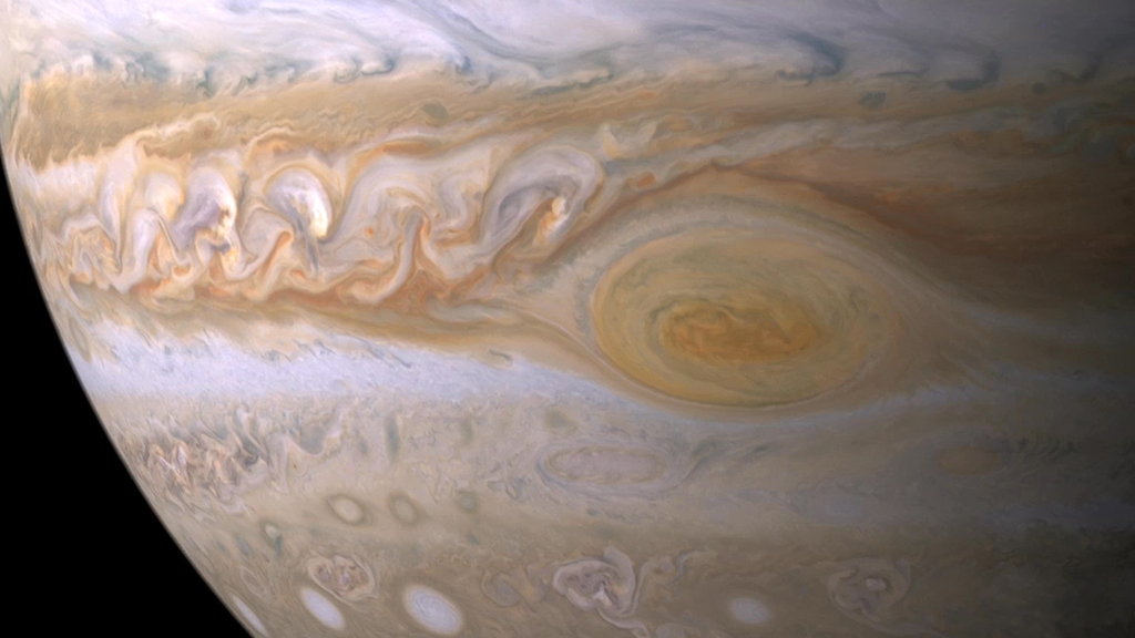 Movies reveal the restless nature of Jupiter's shadowy hot spots and the force behind them.