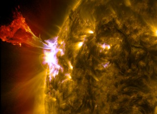 A burst of solar material leaps off the left side of the sun in what's known as a prominence eruption. This image combines three images from NASA's Solar Dynamics Observatory captured on May 3, 2013, at 1:45 pm EDT, just as an M-class solar flare from the same region was subsiding. The images include light from the 131-, 171- and 304-angstrom wavelengths.Credit: NASA/SDO/AIA