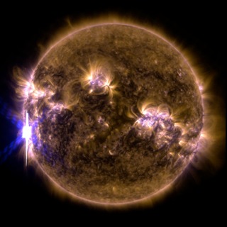 An X-class solar flare erupted on the left side of the sun on the evening of Feb. 24, 2014.  This composite image, captured at 7:59 p.m. EST, shows the sun in ultraviolet light with wavelength of both 131 and 171 angstroms.Credit: NASA/SDO