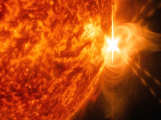 An X 1.4 solar flare erupted on the right side of the sun on the evening of April. 24, 2014. This composite image, captured at 8:42 p.m. EST, shows the sun in ultraviolet light with wavelength of both 131 and 304 angstroms.  Cropped.