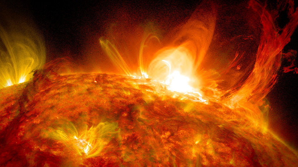 Light and matter erupt from the sun.