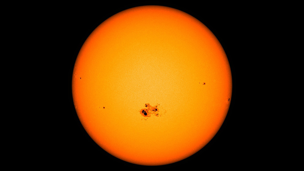 Powerful flares erupt from a supersized sunspot.