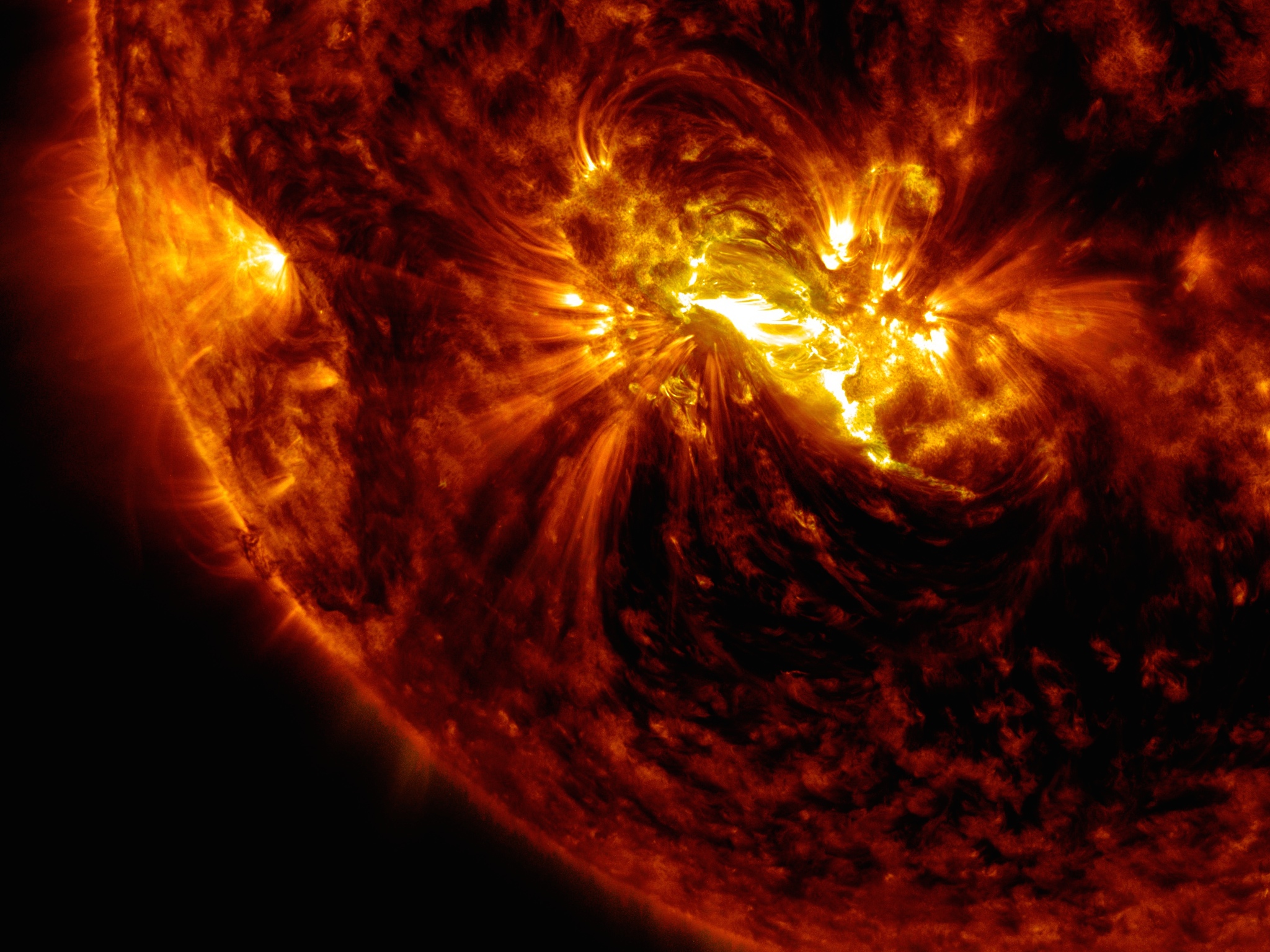 An active region on the sun erupted with a mid-level flare on Oct. 21, 2014, as seen in the bright light of this image captured by NASA's Solar Dynamics Observatory. This image shows extreme ultraviolet light that highlights the hot solar material in the sun's atmosphere. Credit: NASA/GSFC/SDO
