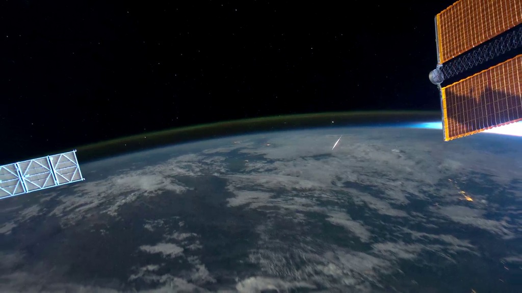 LEAD: Warm summer nights can be enjoyable times to watch for meteor showers. 1. From Earth, streaking meteors seem to appear as shooting stars millions of miles away. 2. But, a picture from the International Space Station clearly captures a meteor BELOW the 250 miles altitude of the space station. 3. The visible streaks are caused by tiny particles burning up in Earth's atmosphere due to friction at altitudes of 50 miles above the surface. TAG: Most meteors are the size of a grain of sand.  Delta Aquarids meteor showers are visible from mid-July with peak activity on July 28 or 29.