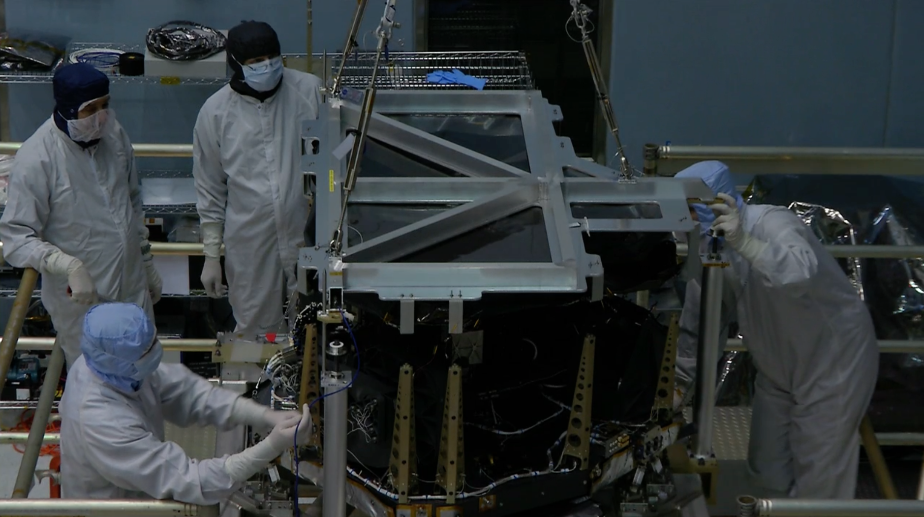 B-roll video of Airbus engineers removing the cover from the Near InfraRed Spectrometer (NIRSpec) instrument