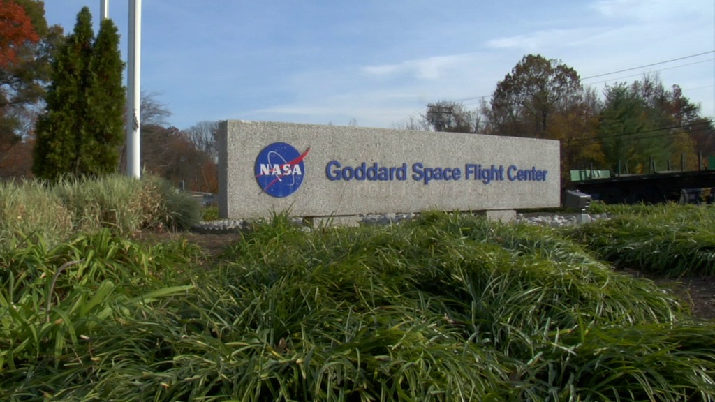 NASA Goddard Scene Setters.  Includes shots of the main gate, the rocket garden, Building 29 exterior, Building 32 exterior, and a Goddard sign by the Space Environment Simulator.
