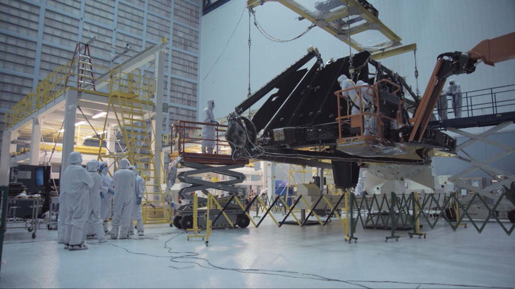 4K B-roll footage of the Webb Telescope Observatory being moved from the rollover fixture to the assembly stand inside the cleanroom.