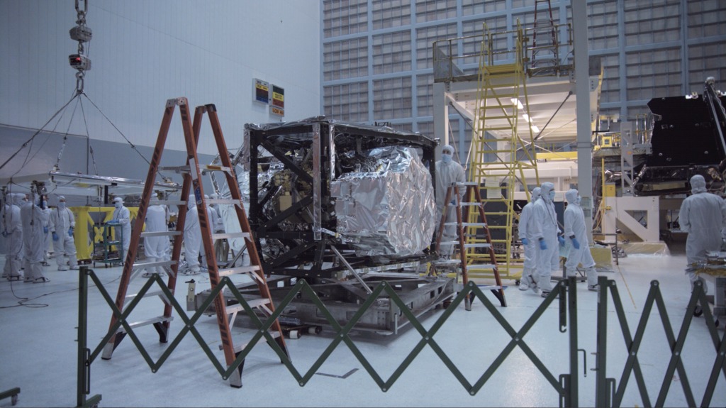 4K b-roll footage of the Integrated Science Instrument Module being installed into the James Webb Space Telescope's Optical Telescope Element.  