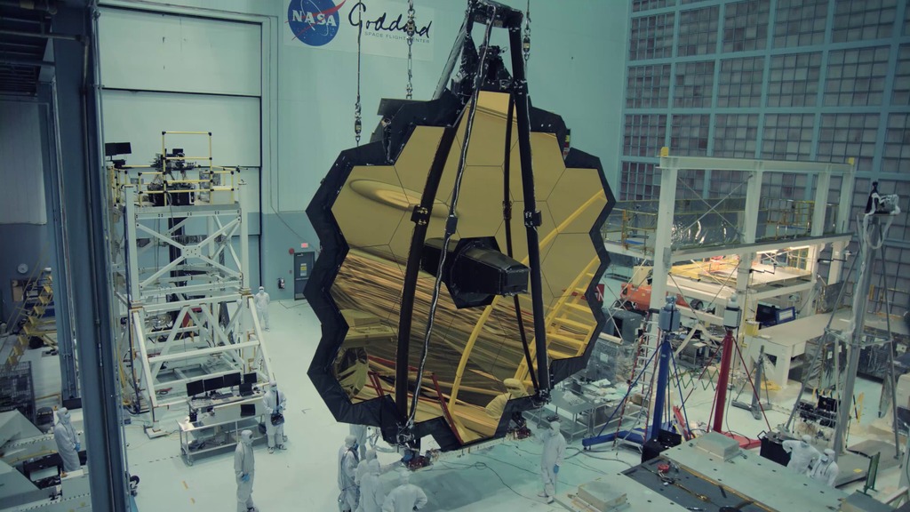 The completed Telescope Element of the James Webb Space Telescope is tilted vertically on a special rollover fixture inside the NASA Goddard Space Telescope cleanroom.  The footage is available in 4k, 1080p ProRes and 1080p h264.  