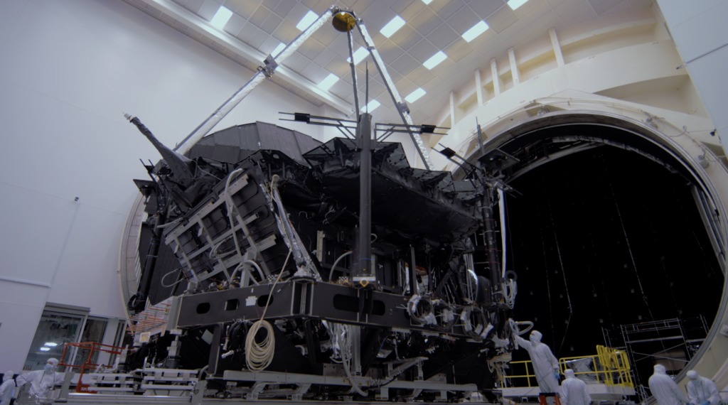 B-Roll footage of engineers at NASA's Johnson Space Center in Houston Texas, rolling the James Webb Space Telescope into Chamber A for future cryogenic testing.