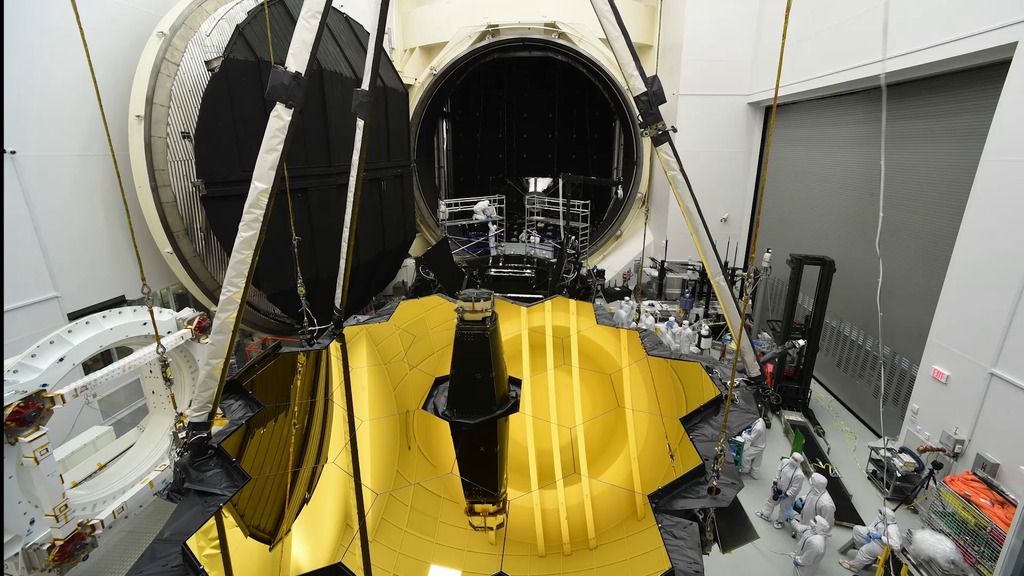A produced time-lapse video of activity in the NASA Johnson Space Center's Chamber A cleanroom from the arrival of the Webb Telescope's optical and instrument segment through to its roll out from the chamber after completing it's cryogenic testing.