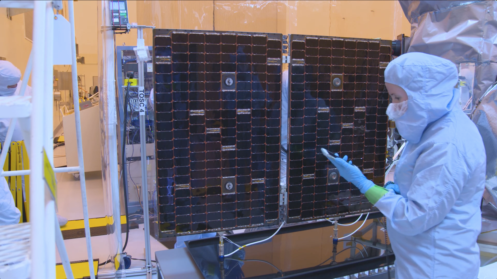 Engineers at the Kennedy Space Center test TESS's solar panels.