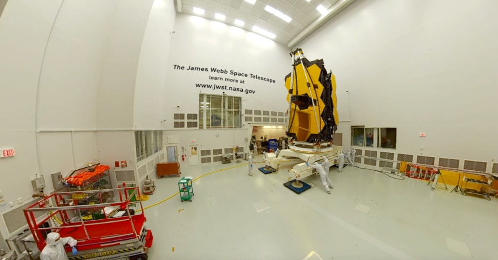 360 B-Roll of the James Webb Space Telescope being moved foward by engineers inside NASA's Johnson Space center's cleanroom in Houston, Texas.  