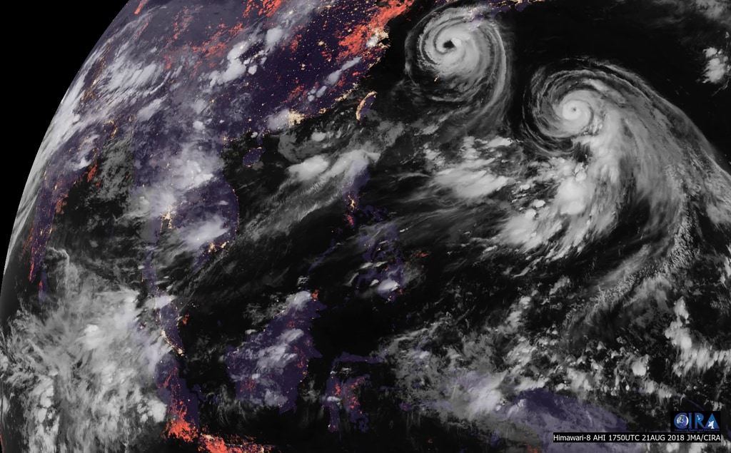 Smoke off the west coast of Borneo and dueling tropical cyclones in the Philippine Sea in this color image from the Advanced Himawari Imager aboard the JAXA Himawari-8 satellite, from August 21st, 2018.Credit: CIRA/CSU and JAXA/NOAA/NASA