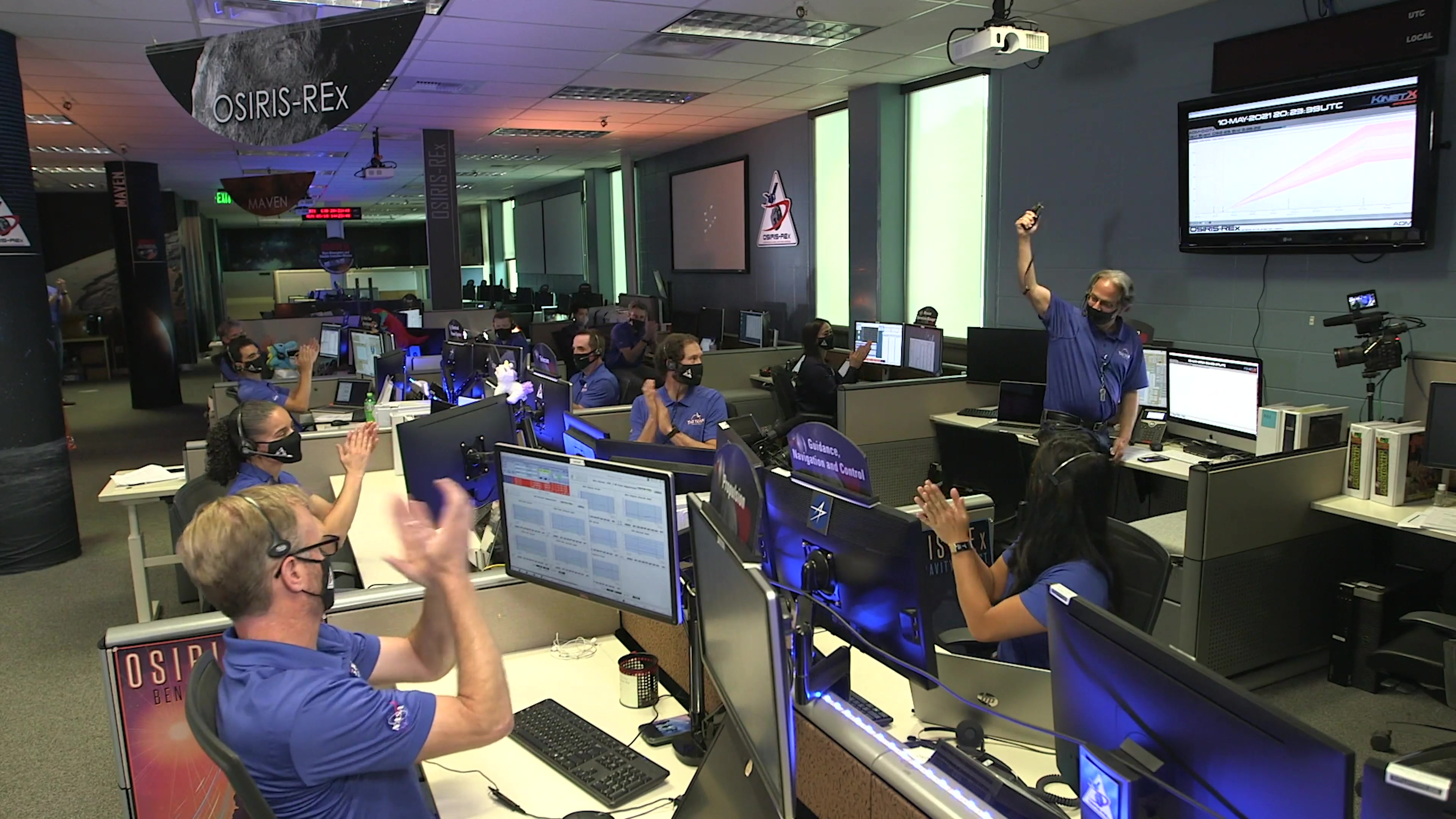 Mission team members celebrate OSIRIS-REx's successful main engine burn that sets the spacecraft on its 2.5-year journey to Earth with samples from asteroid Bennu.Music is "Arise" by Jose Tomas Novoa Espinosa and Sebastian Felipe Olivares de Simone of Universal Production Music.