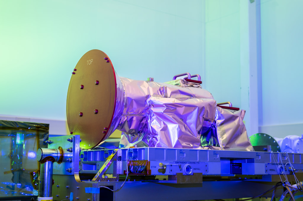 NASA’s Atmospheric Waves Experiment, or AWE, payload is shown in this May 26, 2023, photo at Space Dynamics Laboratory facilities on Utah State University’s Innovation Campus with its red remove-before-flight covers installed. (Photo Credit: SDL/Allison Bills)