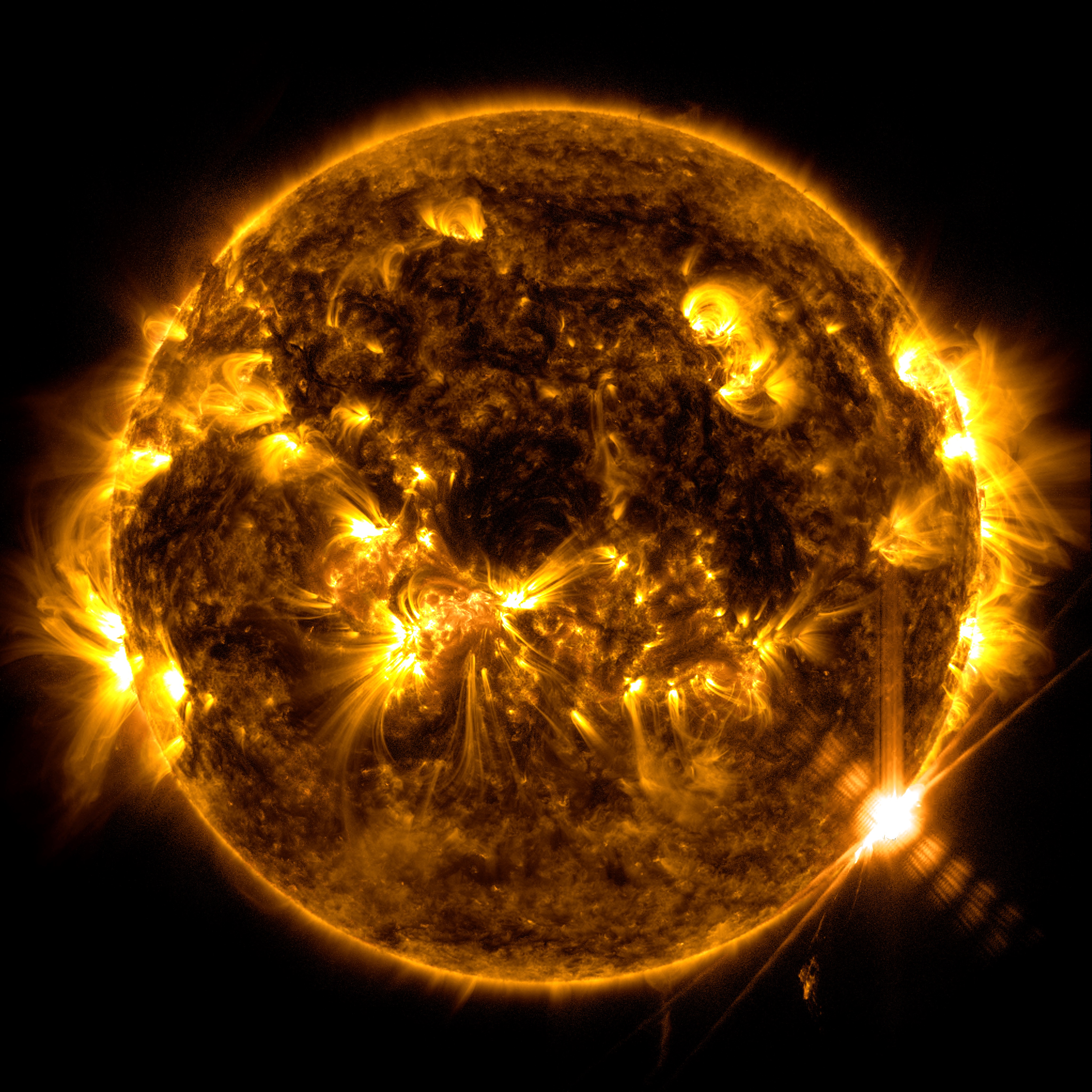 NASA’s Solar Dynamics Observatory captured this image of a solar flare – as seen in the bright flash on the lower right – on Feb. 9, 2024. The image shows a blend of  171 Angstrom and 131 Angstrom light, subsets of extreme ultraviolet light that highlight the plasma loops in the corona and the extremely hot material in flares, respectively. Credit: NASA/SDO