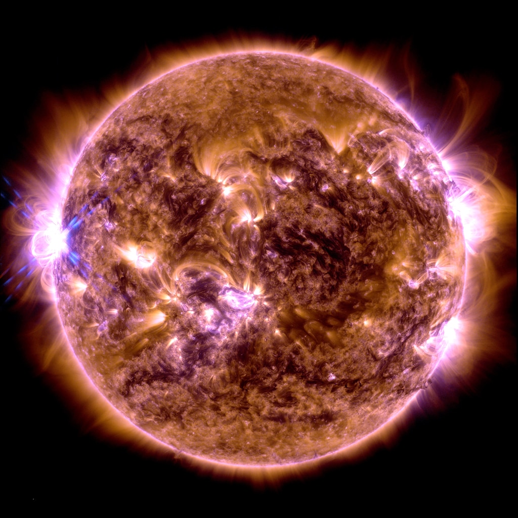 NASA’s Solar Dynamics Observatory captured this image of a solar flare – as seen in the bright flash on the left – on Dec. 31. 2023. The image shows a blend of 171 and 131 Angstrom extreme ultraviolet light that highlights the extremely hot material in flares and which is colorized in blue and gold.Credit: NASA/GSFC/SDO