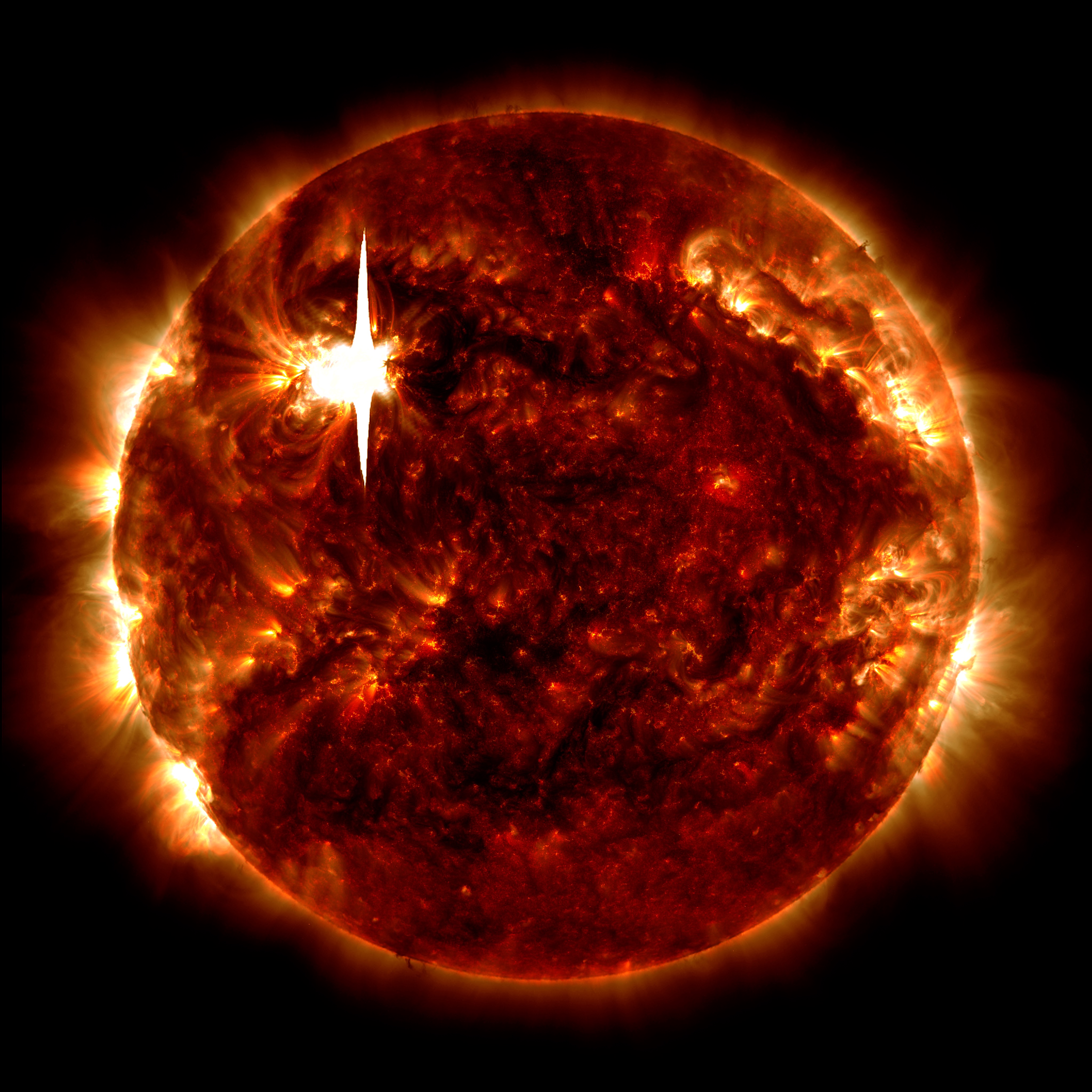NASA’s Solar Dynamics Observatory captured this image of a solar flare – as seen in the bright flash on the upper left – on Feb. 22, 2024. The image shows a blend of 171 Angstrom, 193 Angstrom and 1600 Angstrom light, subsets of ultraviolet and extreme ultraviolet light.  Credit: NASA/SDO